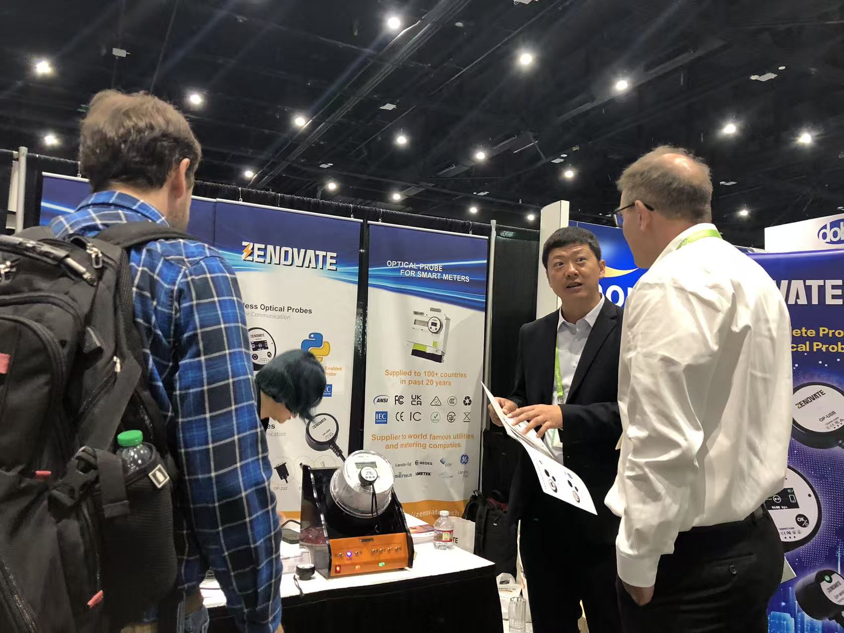 Zenovate team demonstrating products to visitors at DTECH 2026 in San Diego