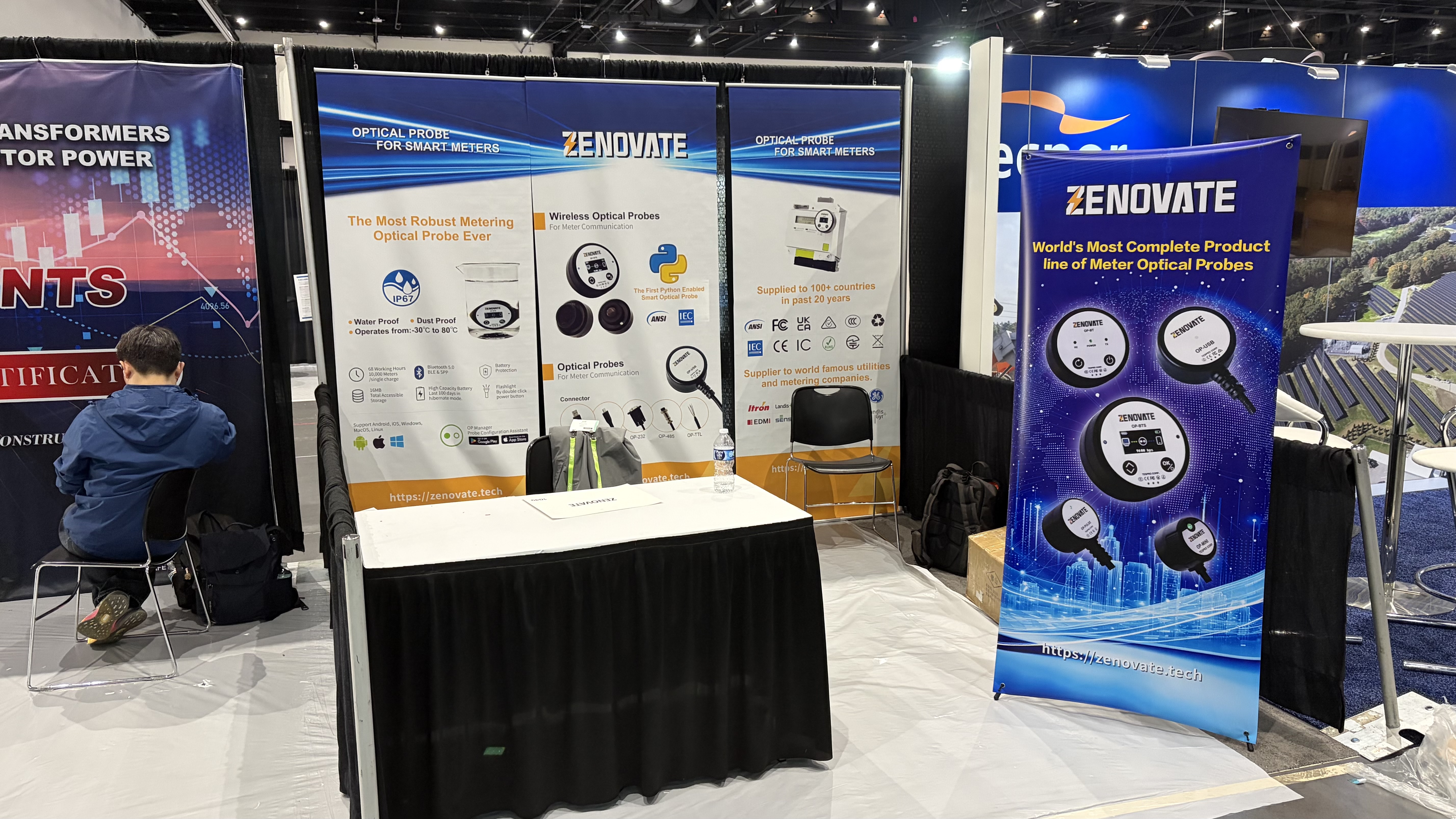 Zenovate exhibition booth at DTECH 2026 with OP-BTS and optical probe banners