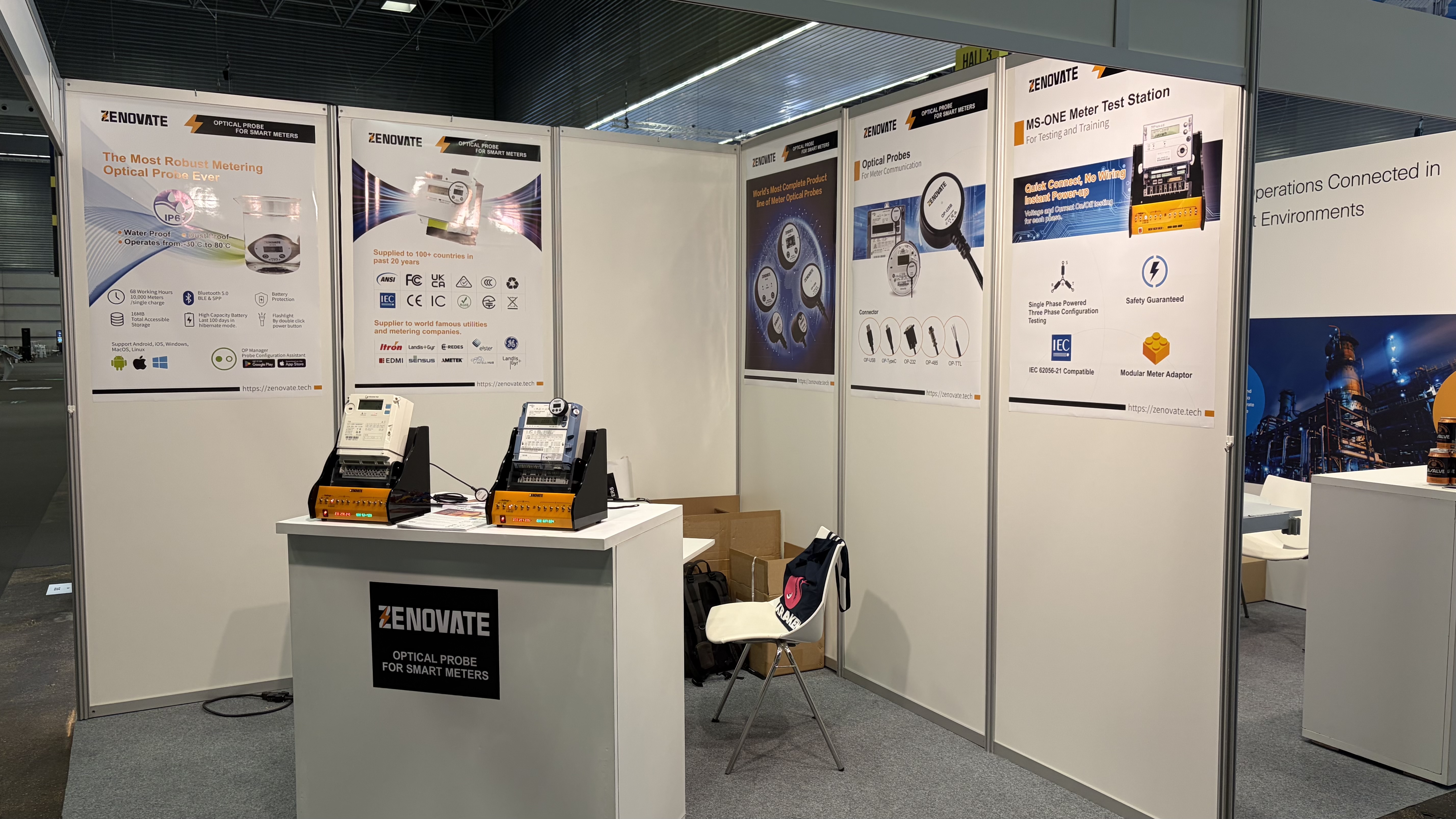 Zenovate booth displaying MS-ONE meter test stations and OP Series posters at Enlit Europe 2025