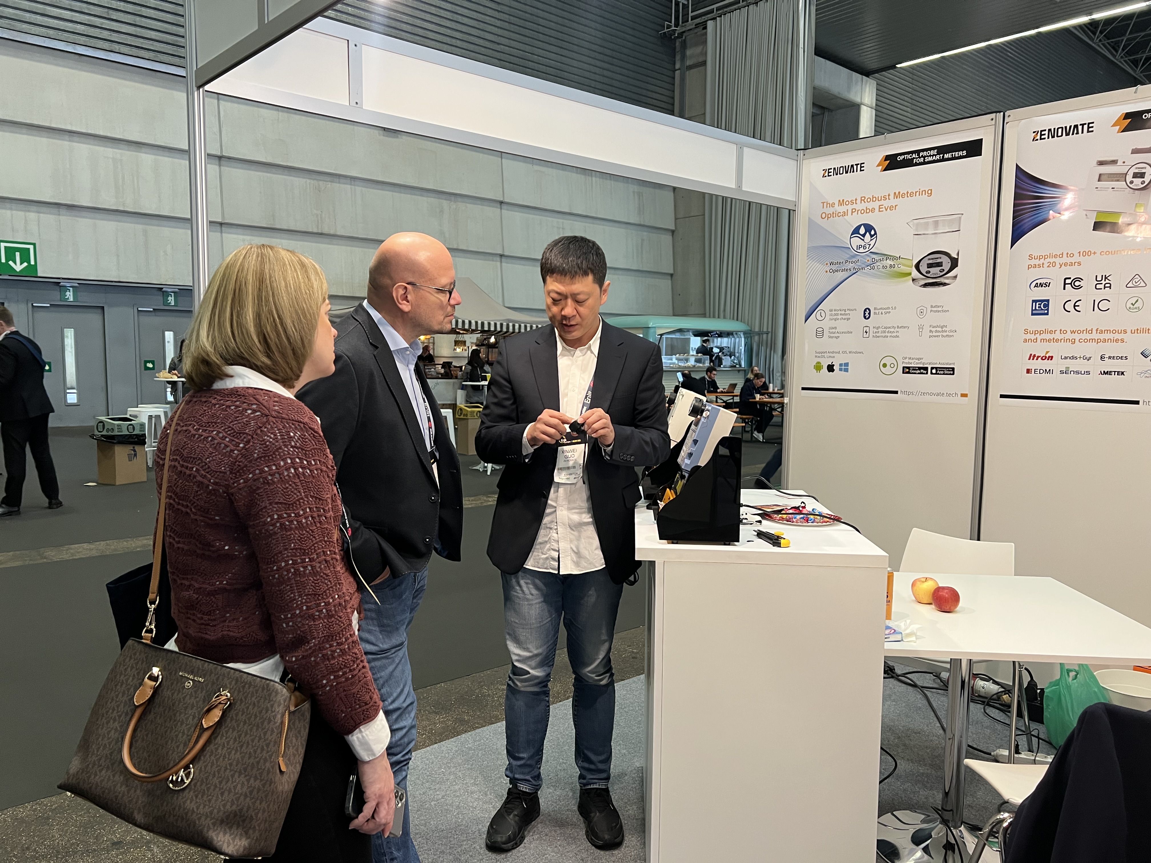 Zenovate representative demonstrating an OP Series optical probe to visitors at Enlit Europe 2025